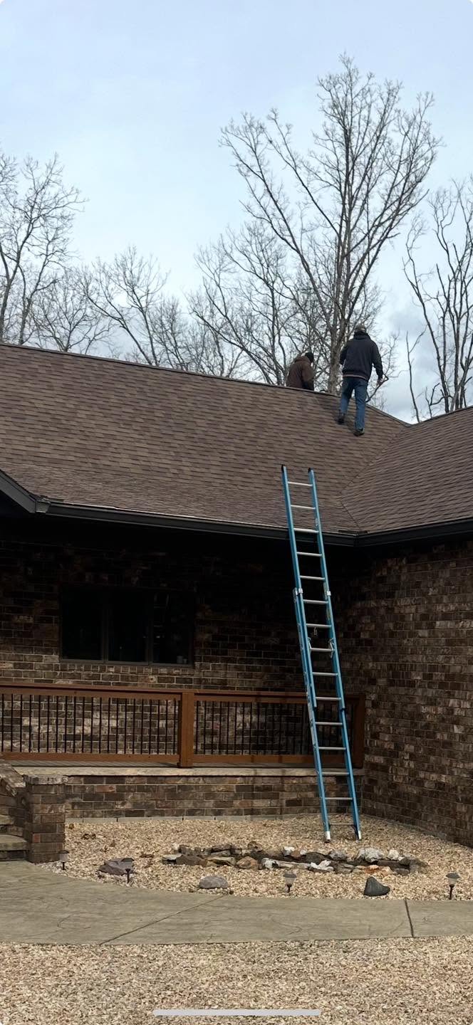 Ocho Roofing crew walking a roof during an adjuster meeting